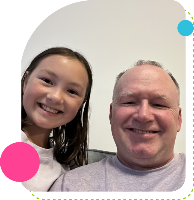 Smiling man and girl taking selfie together.